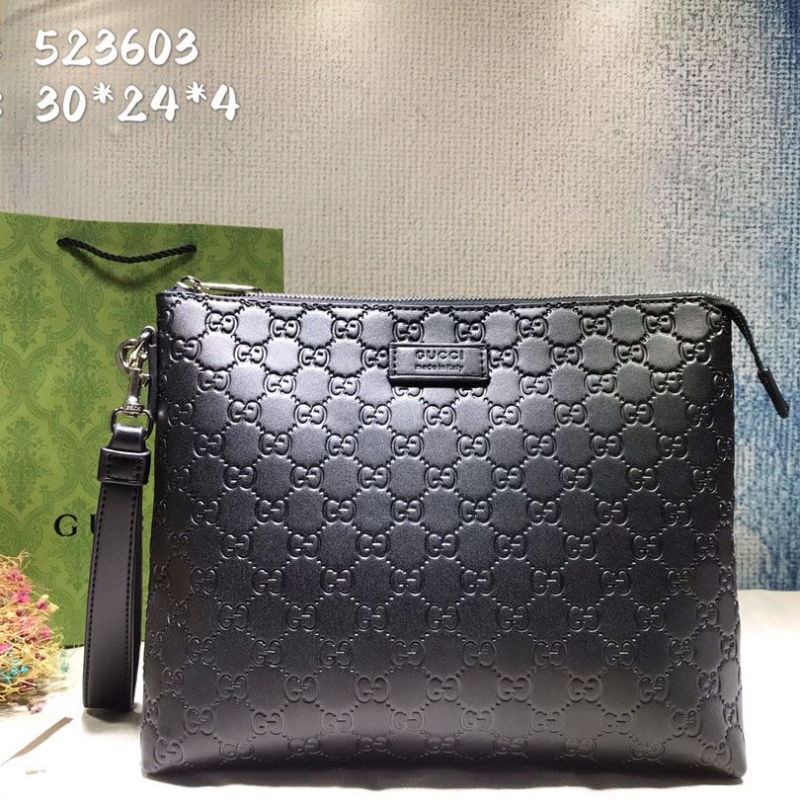 G*u*i clutch bags